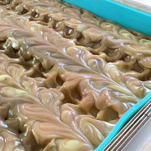 Charger l'image dans la galerie, Gros plan sur le savon Smoothie Visage à la Tangerine. Le savon est dans le moule une fois frais coulé Le dessus est joliment texturé.